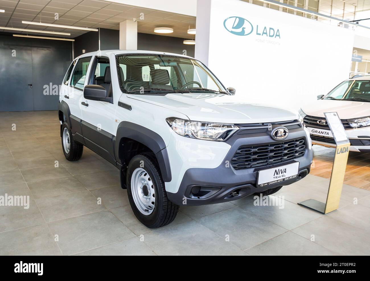 Samara, Russia - May 14, 2023: Brand new Lada Niva Travel offroad vehicle next the office of official dealer Stock Photo