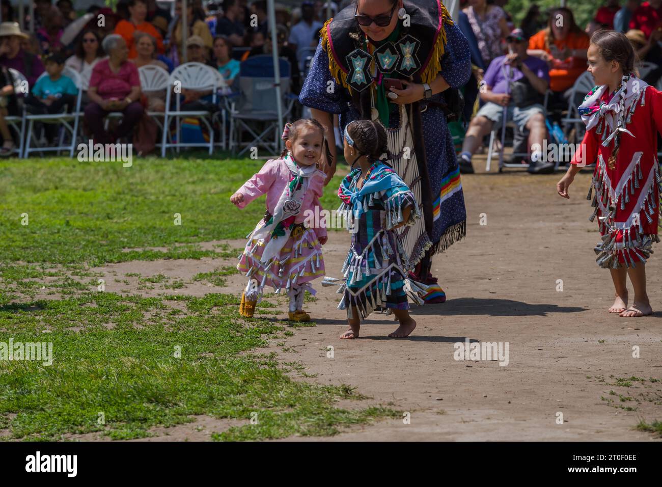 Traditional Pow Wow dance festival. A full day of dancing, drumming and performances. first nations children dance in traditional clothes Stock Photo