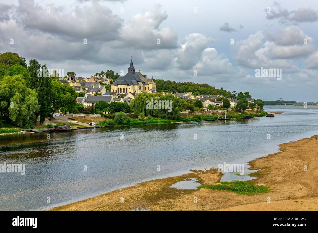 View over the Vienne near Candes-Saint-Martin to the pilgrimage church St. Martin. The municipality of Candes-Saint-Martin is located directly at the mouth of the Vienne into the Loire. Stock Photo