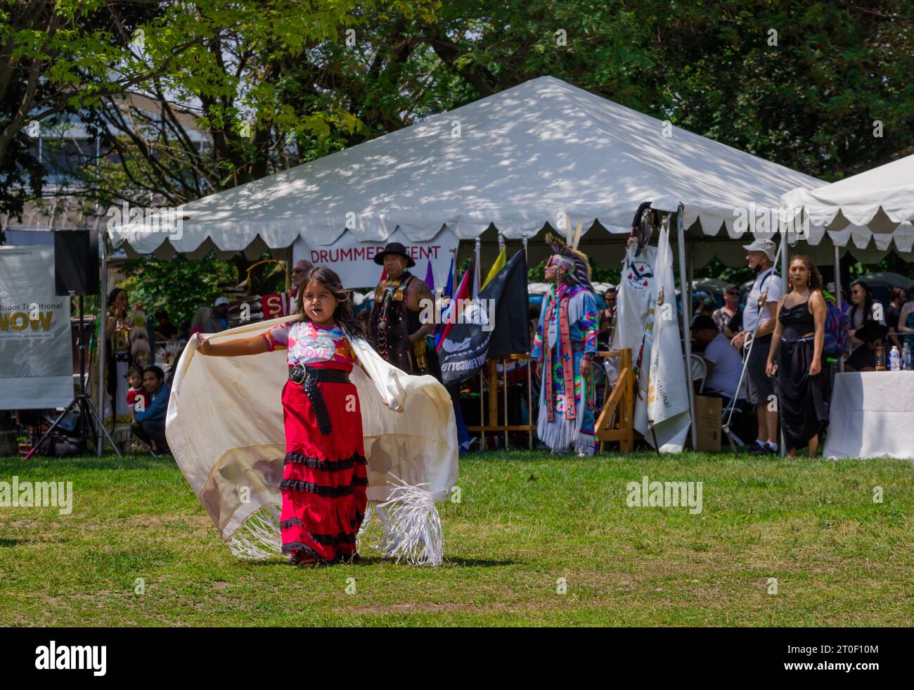 Traditional Pow Wow dance festival. A full day of dancing, drumming and performances. first nations children dance in traditional clothes Stock Photo