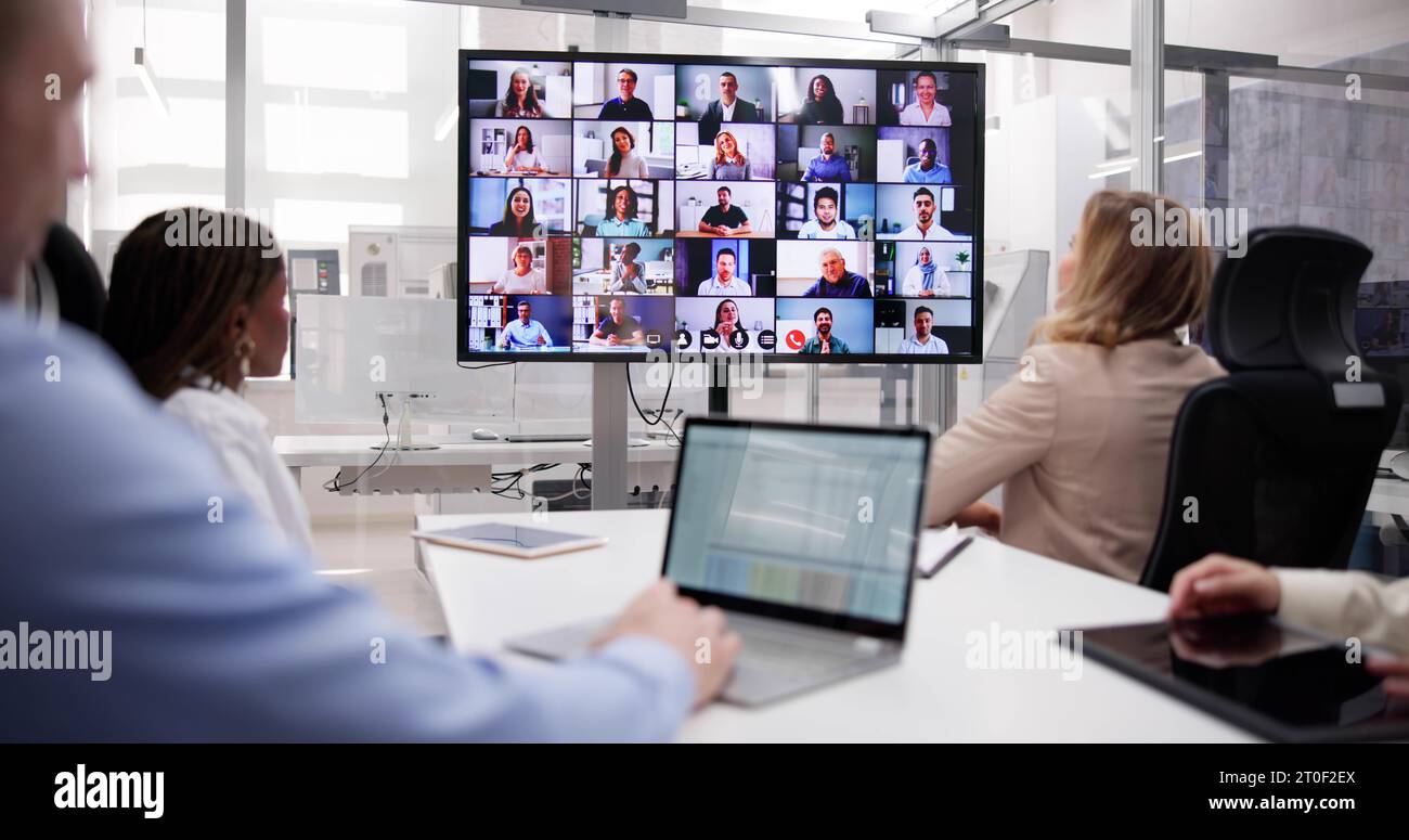 Online Video Conference Call In Boardroom Meeting Stock Photo