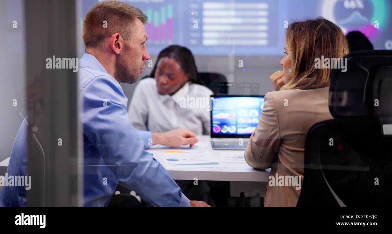 Diverse team in dark office hi-res stock photography and images - Alamy