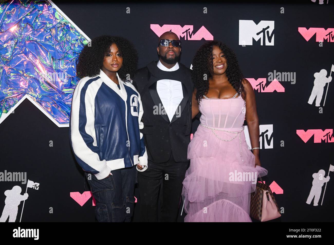 Angelina Claudinelle Jean, Wyclef Jean and Claudinette Jean attend the