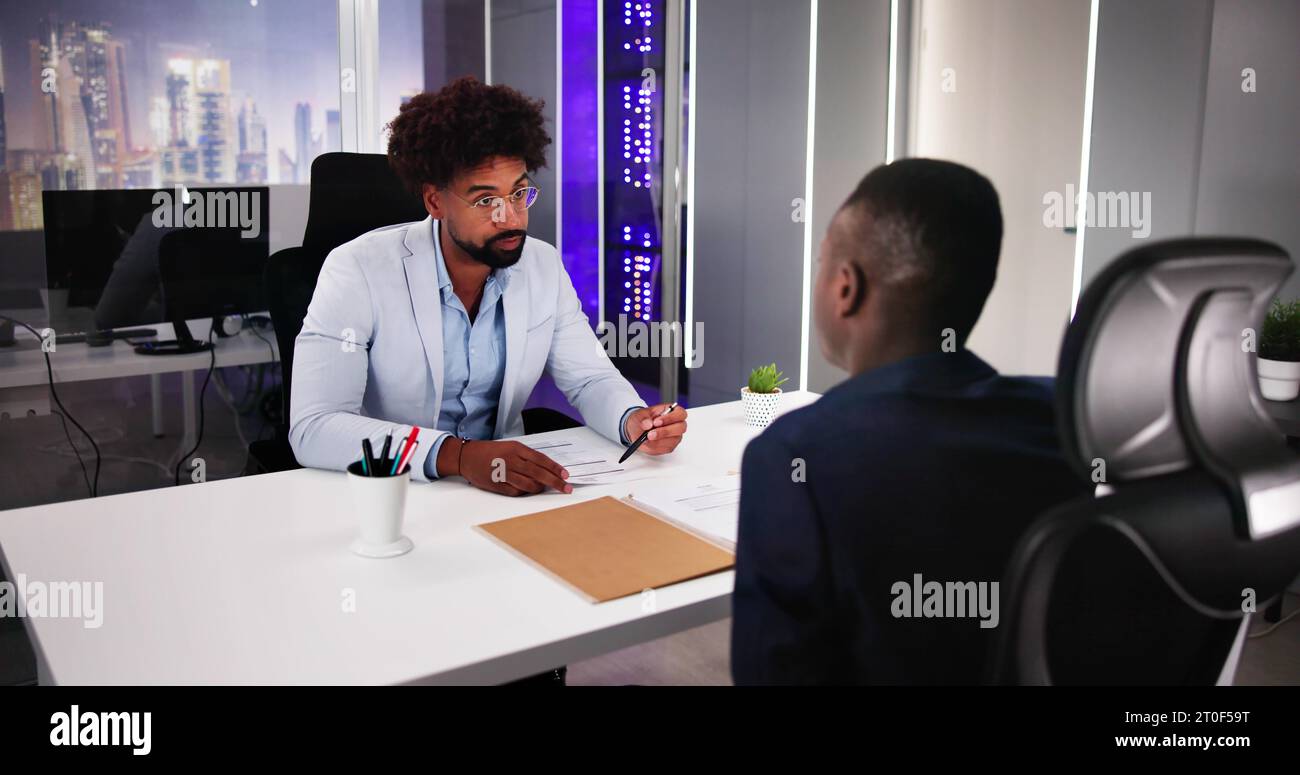 Smiling Young Businessman Shaking Hands With His Partner Stock Photo
