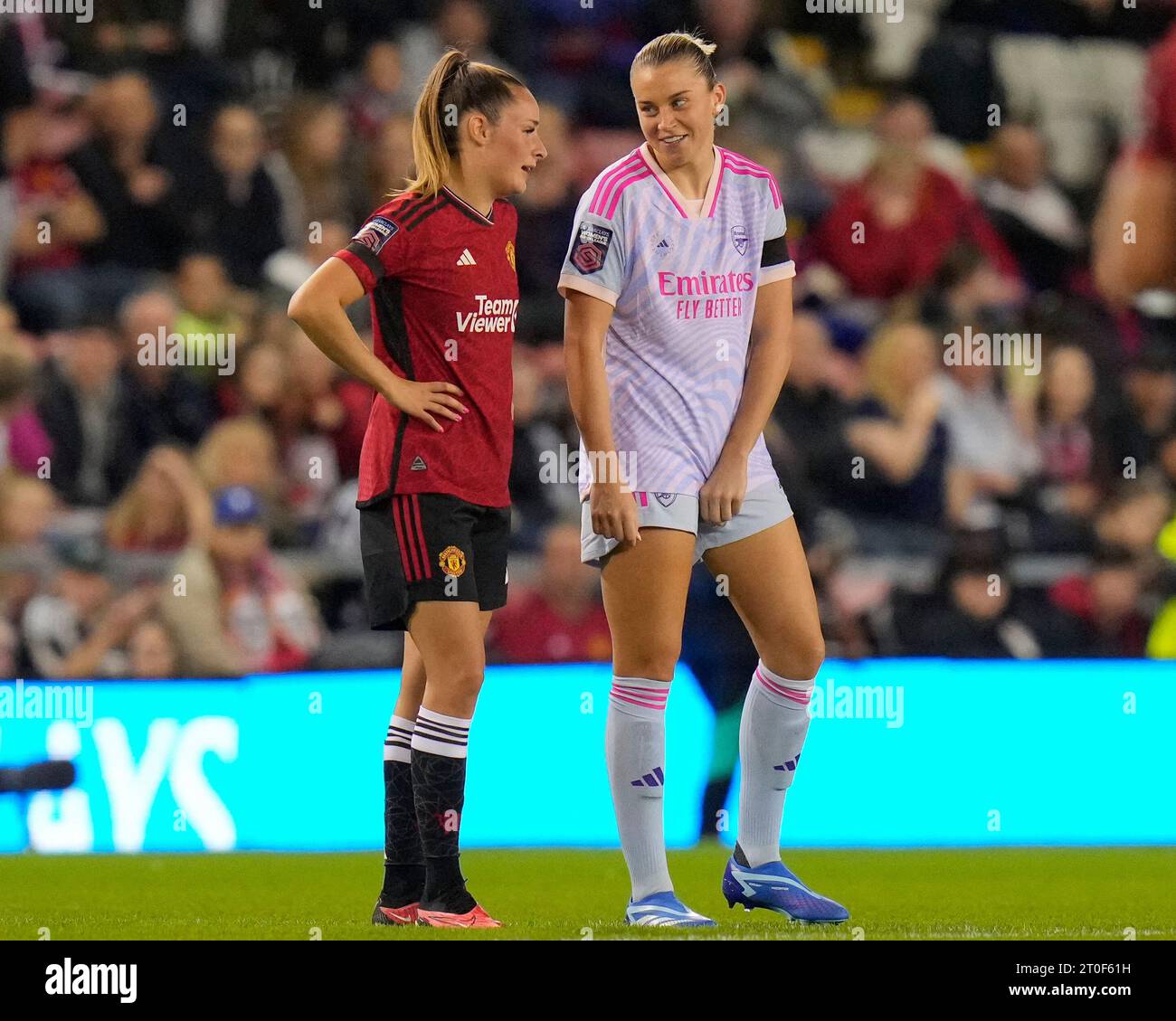 Ella Toone #7 of Manchester United jokes with former team mate Alessia Russo #23 of Arsenal Women during the The FA Women's Super League match Manchester United Women vs Arsenal Women at Leigh Sports Village, Leigh, United Kingdom, 6th October 2023  (Photo by Steve Flynn/News Images) Stock Photo