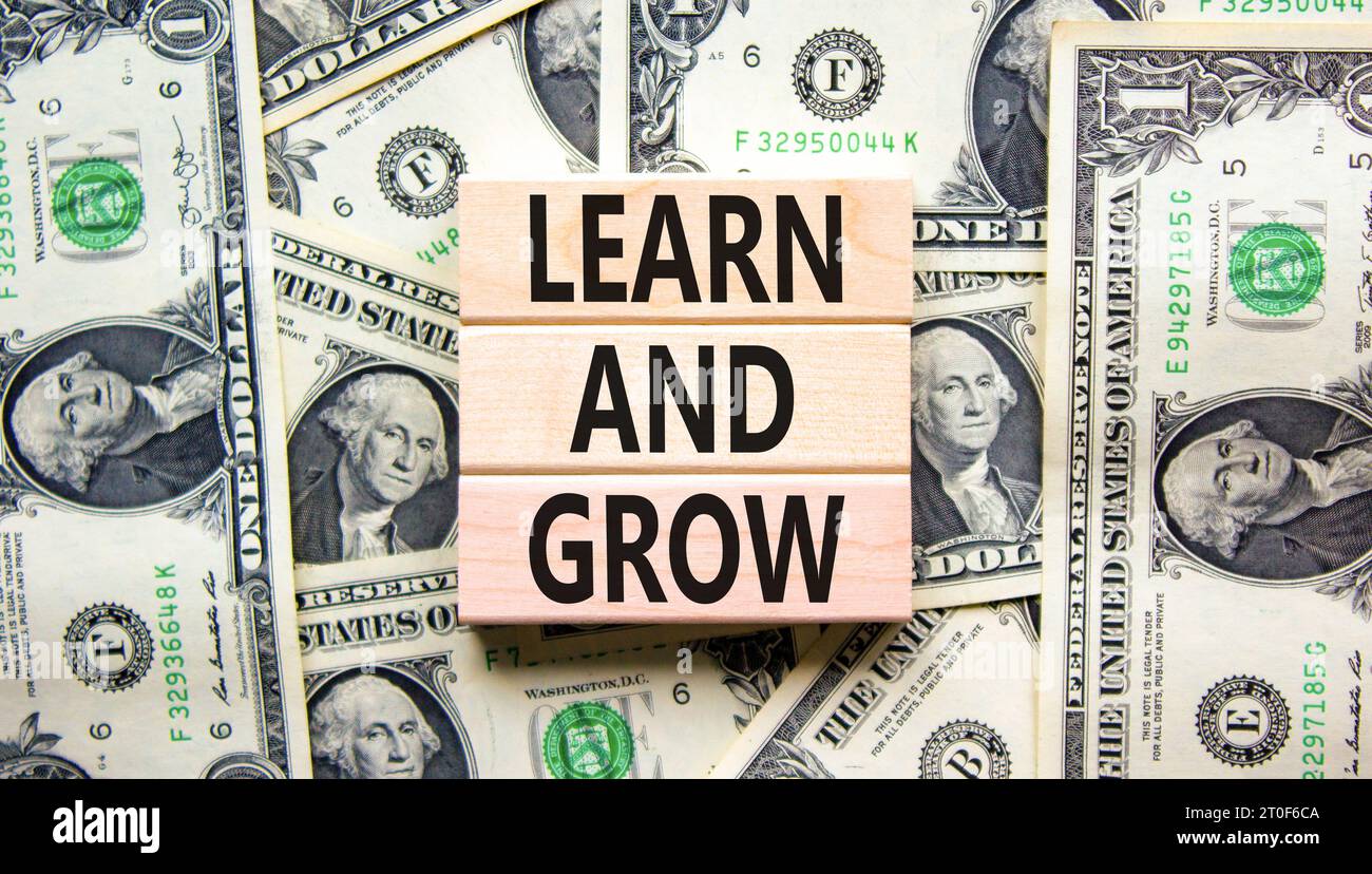 Learn and grow symbol. Concept word Learn And Grow on beautiful wooden ...