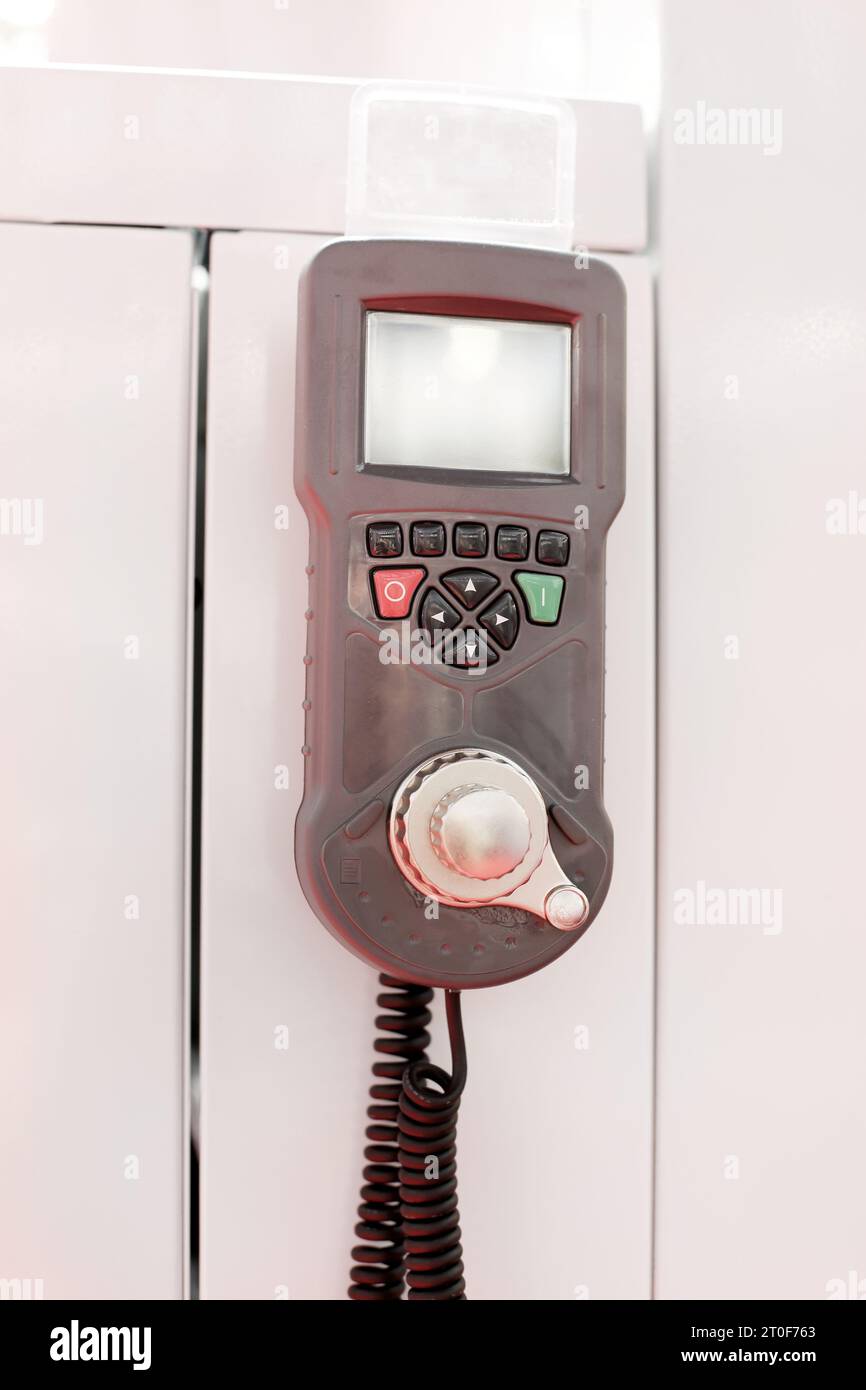 Wired Machine Remote Control With Display and Precise Jog Dial in Factory Stock Photo