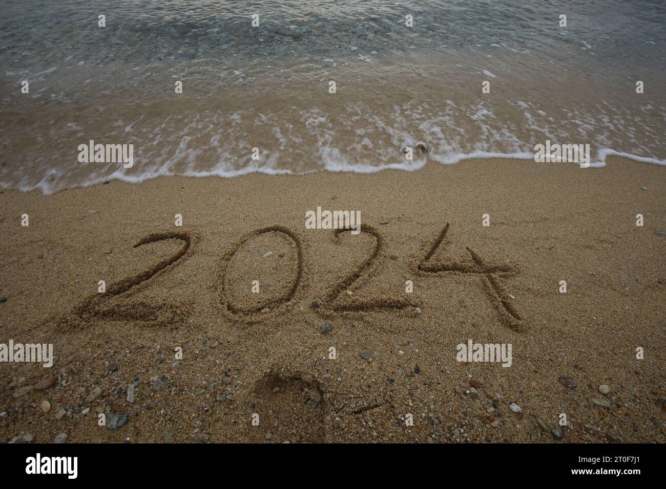 Summertime 2024 Lettering New Year 2024, lettering on the beach with wave and clear blue sea ...