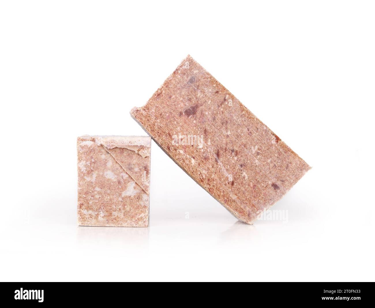 Staked frozen meat blocks. Raw food diet or barf for dogs, cats and pets. Organic human grade ground chicken with muscle, bone and organs for large do Stock Photo