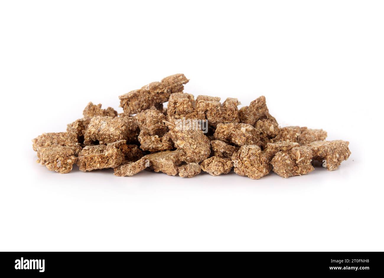 Pile of dried fish pieces for dogs and cats as snack, treat or reward. Heap of dehydrated flaky fish chunks to break. Healthy dog snack or health supp Stock Photo