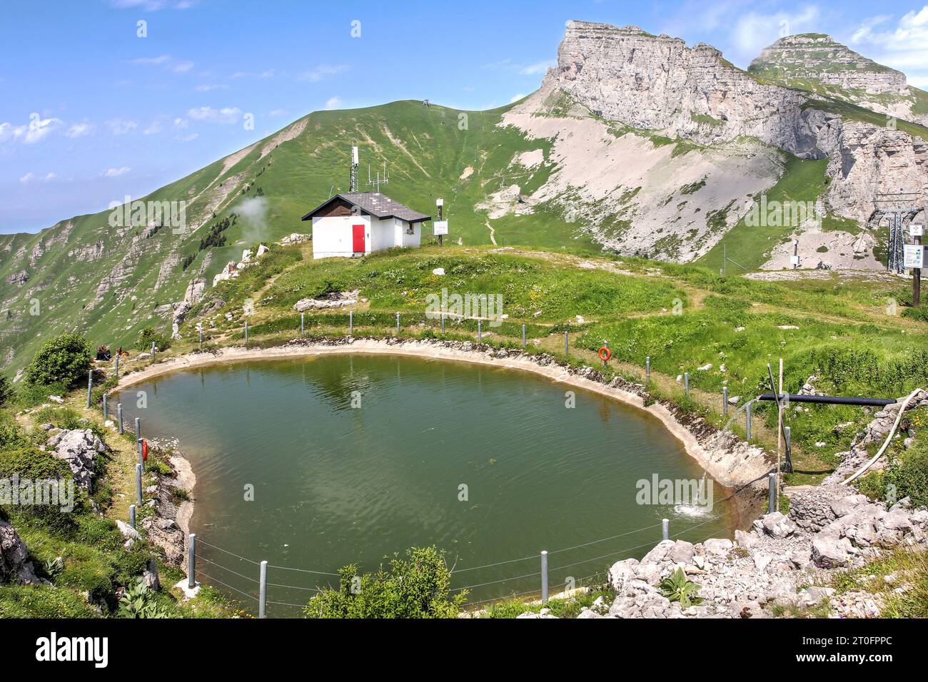 Beautiful view from Berneuse above the resort town of Leysin, Switzerland with a small lake and dramatic Tour d'Ai and Tour de Mayen, part of Vaud Alp Stock Photo