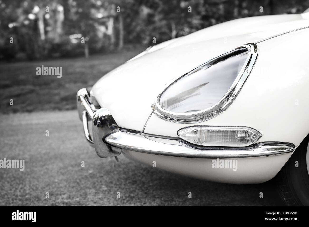 Vintage sport car front in black and white. Side view. Muscle car or