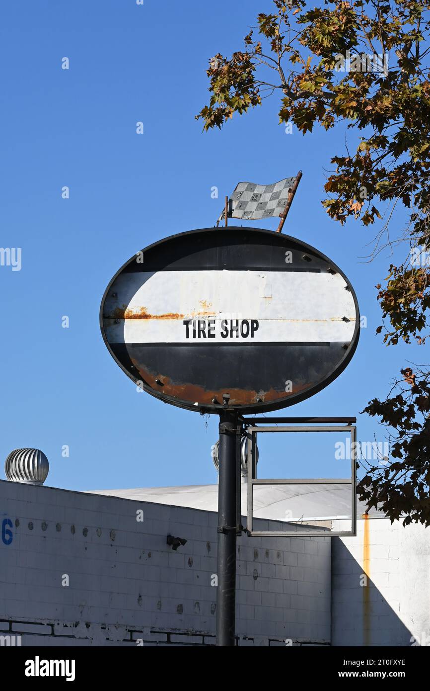 SANTA ANA, CALIFORNIA - 1 OCT 2023: Tire Shop sign on repair facility on 1st Street in Santa Ana. Stock Photo