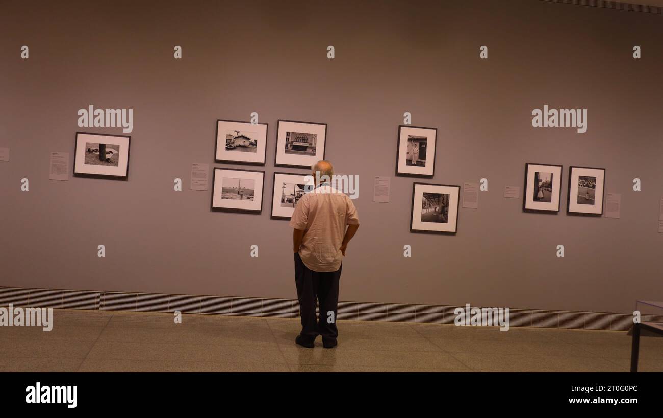 Houston, Oct. 8. 7th Jan, 2024. A visitor views a photograph at the preview of a photo exhibition titled Robert Frank and Todd Webb: Across America, 1955 at the Museum of Fine Arts, Houston, Texas, the United States, on Oct. 6. 2023. A total of 100 photographs chart the cross-country journeys of two photographers, who each captured singular views of America in the mid-20th century, during the exhibition here from Oct. 8, 2023 to Jan. 7, 2024. Credit: Xu Jianmei/Xinhua/Alamy Live News Stock Photo