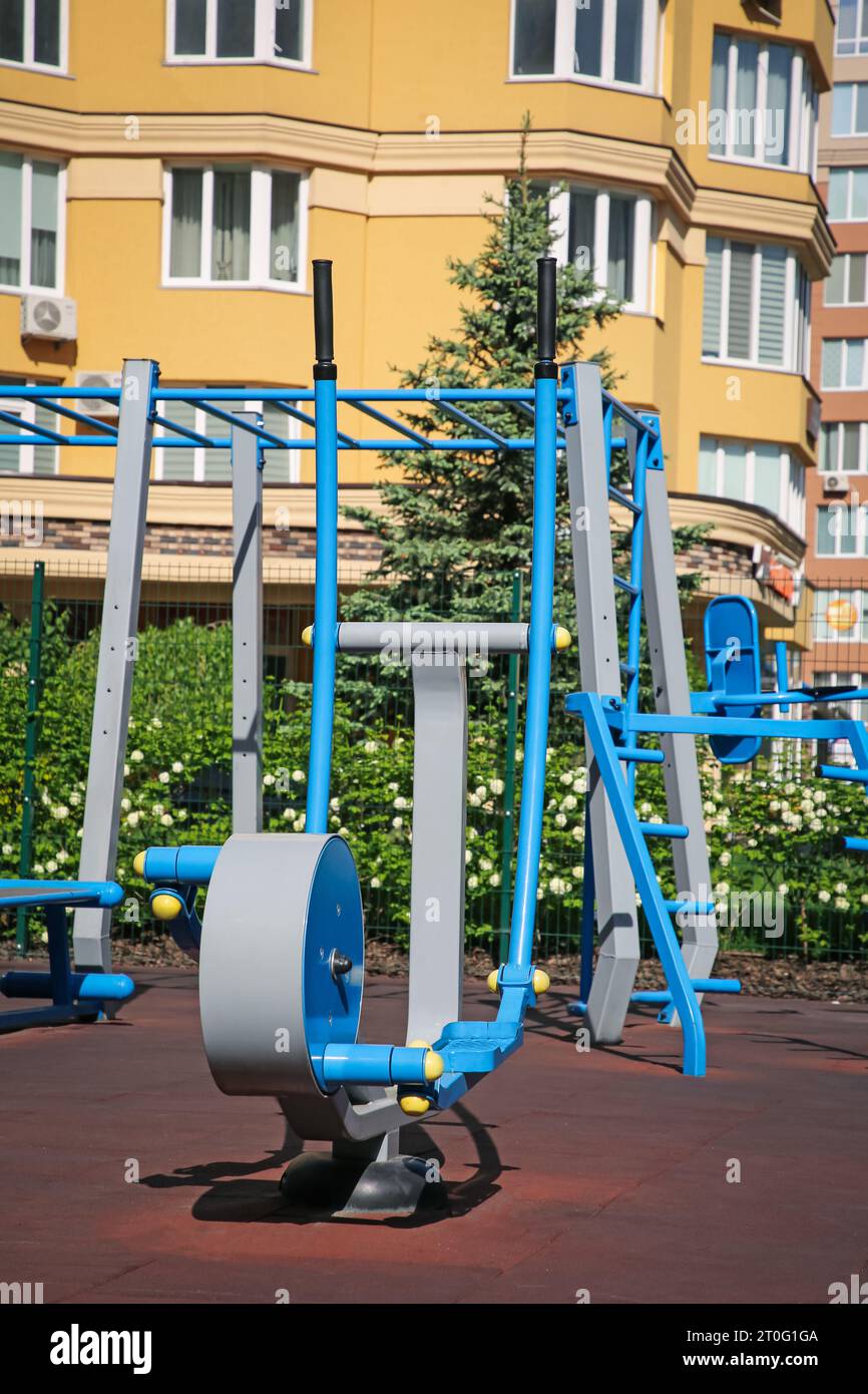 Empty outdoor gym with air walker and monkey bars in residential area Stock Photo