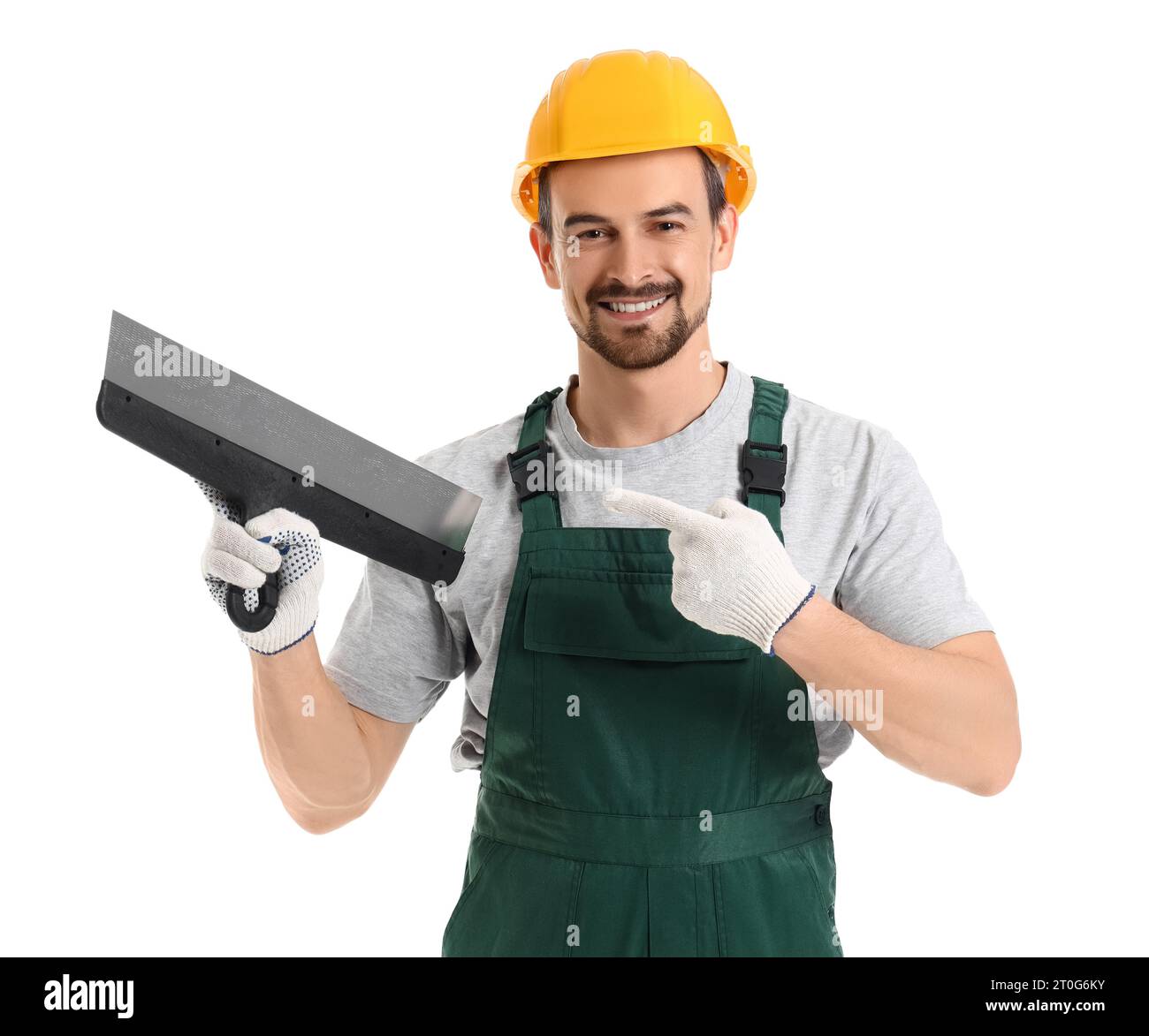 Male decorator pointing at putty knife on white background Stock Photo ...