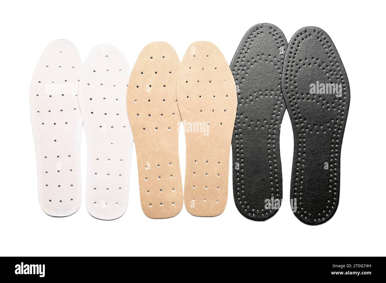 Set of different orthopedic insoles on white background Stock Photo - Alamy