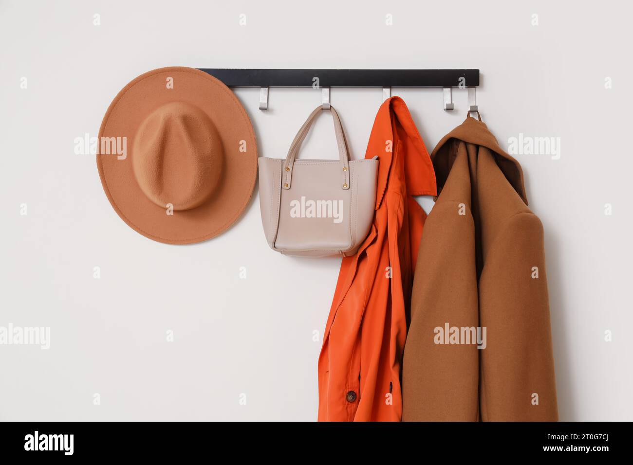 Coats hanging in corridor hi-res stock photography and images - Alamy