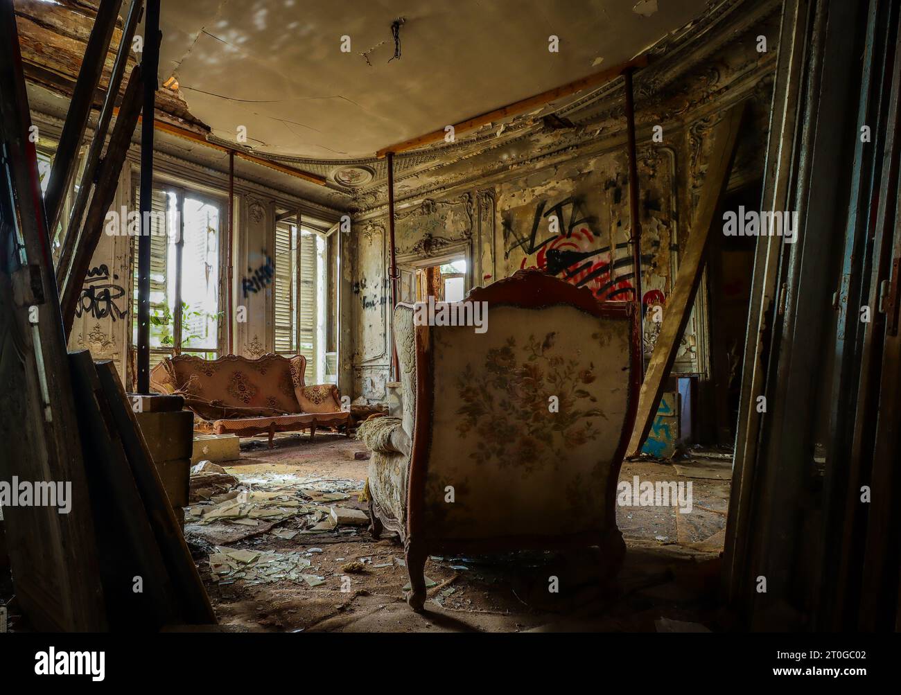 empty living room with old baroque furniture in a lost place building Stock Photo