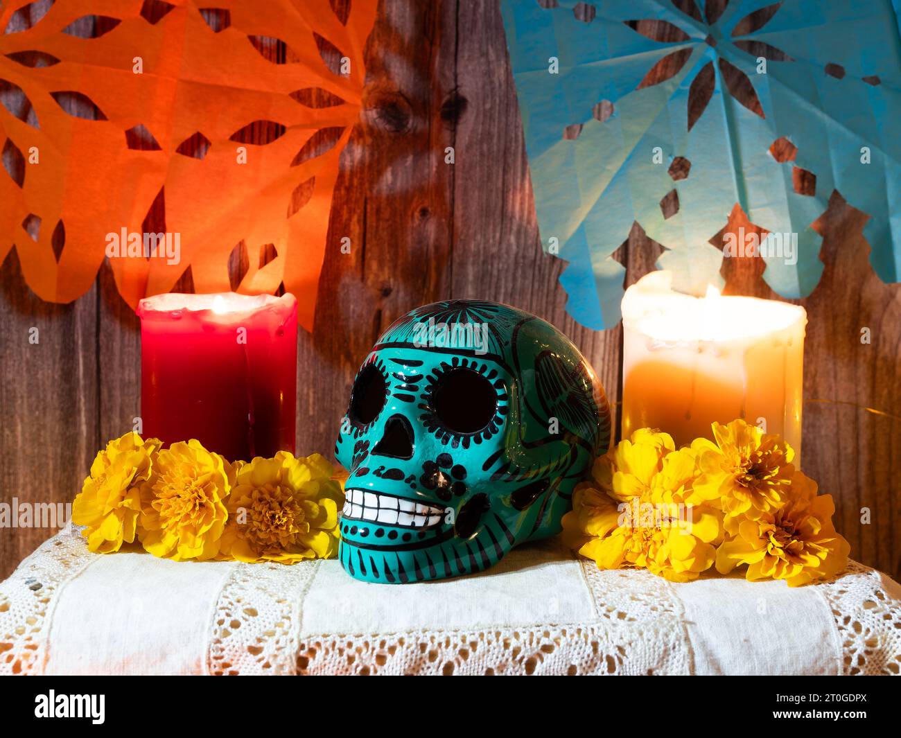 Composition of traditional altar for Mexican day of the dead with skull , candles , offering and