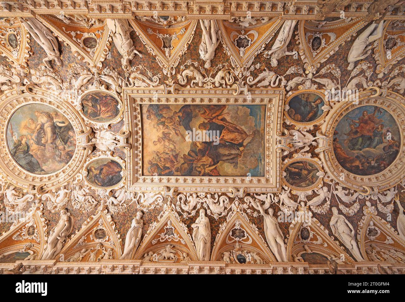 The Four Doors Room a magnificent and detailed coffered ceiling with intricate stucco work in Doge Palace, including painting of Tintoretto and Titian Stock Photo
