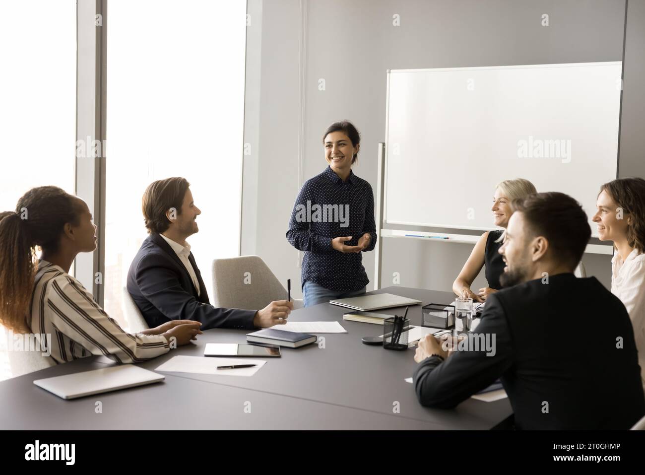 Happy creative multiethnic team of employees working on project together Stock Photo