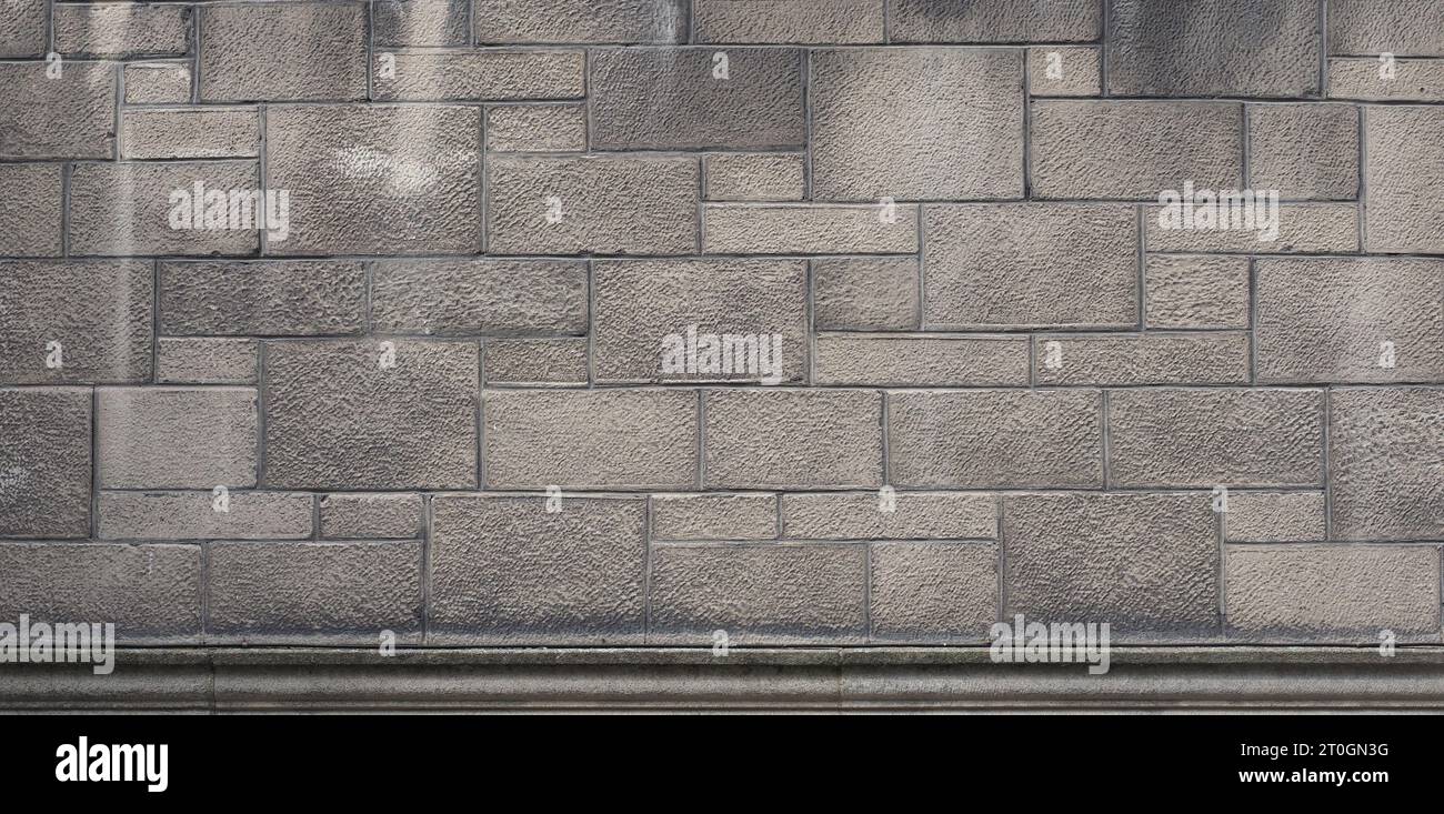 grey stone wall useful as a background Stock Photo - Alamy