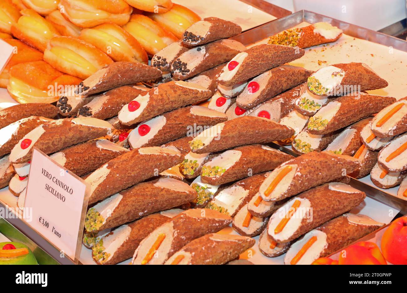 Sicilian cannoli the typical dessert of the Sicily region in southern Italy for sale in the stall Stock Photo