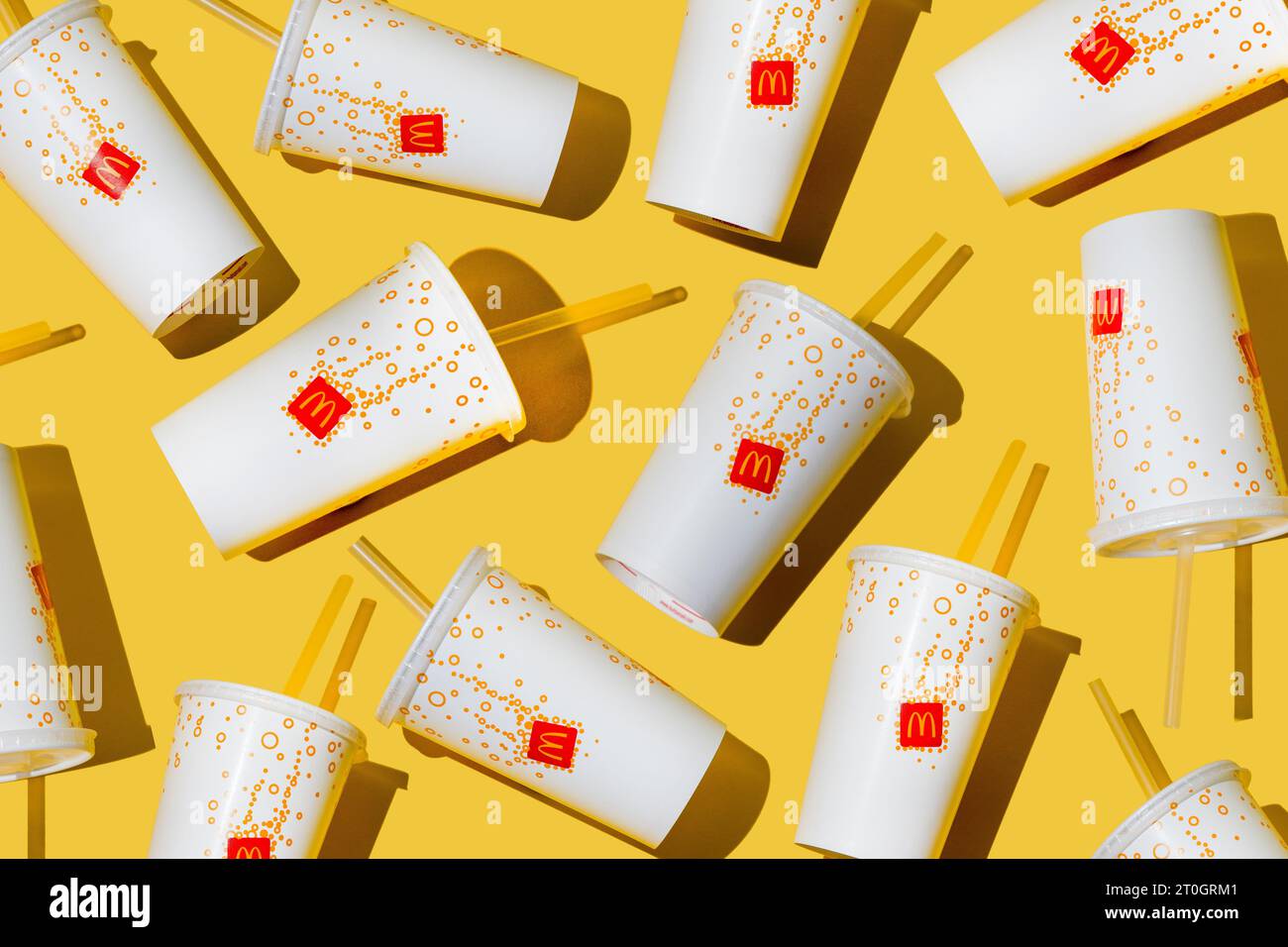 Yellow glass of McDonald's. Paper cup with lid. Takeaway drink ...