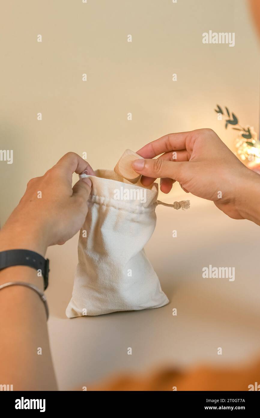 Hands open small, canvas drawstring bag, muslin favor bag mockup with