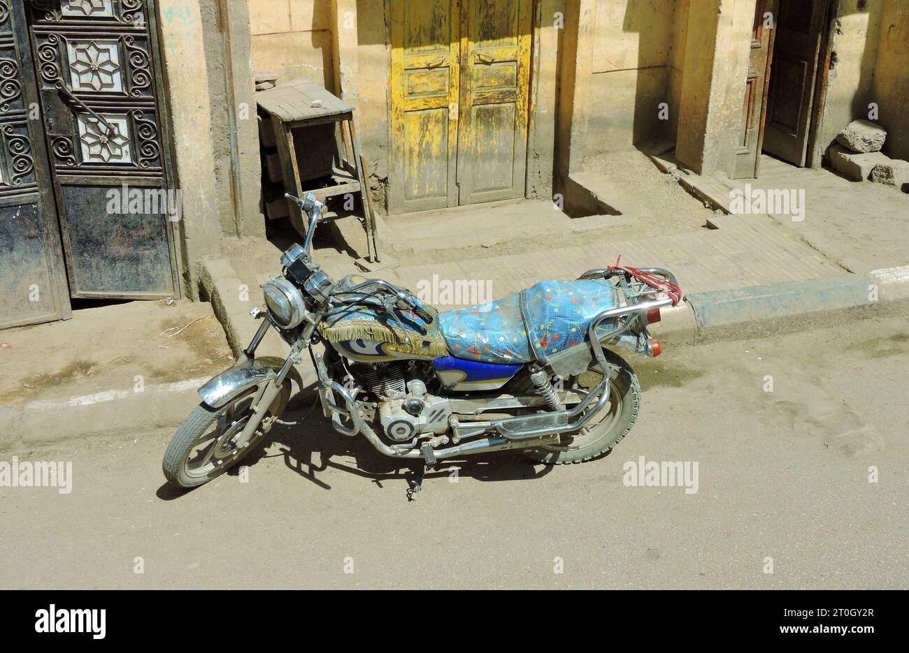Egypt, April 2 2015 A motorcycle customized by an Egyptian is parked in front of a house. It's a Victory Hammer S Stock Photo