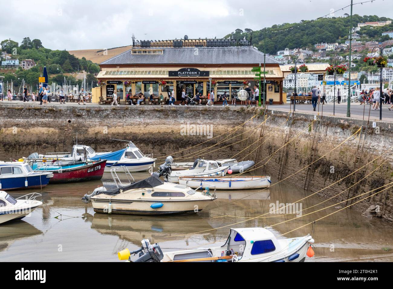 View Looking Across Dartmouth Inner Harbour to the Old Railway Station on the Riverside, Embankment, With Distant Kingswear. Stock Photo