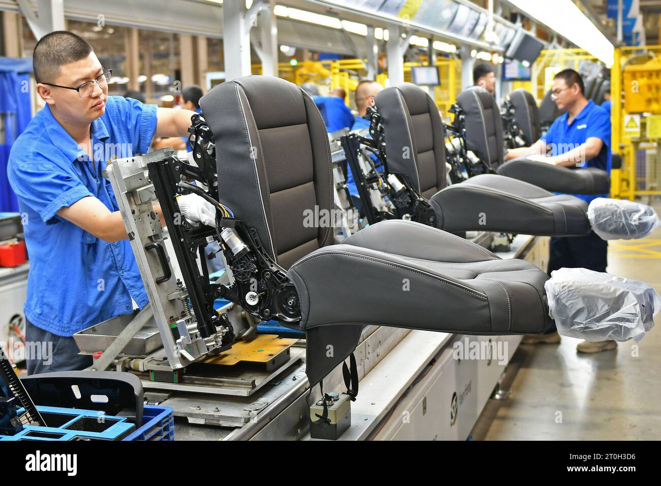 YANTAI, CHINA OCTOBER 7, 2023 Workers assemble car seats on a