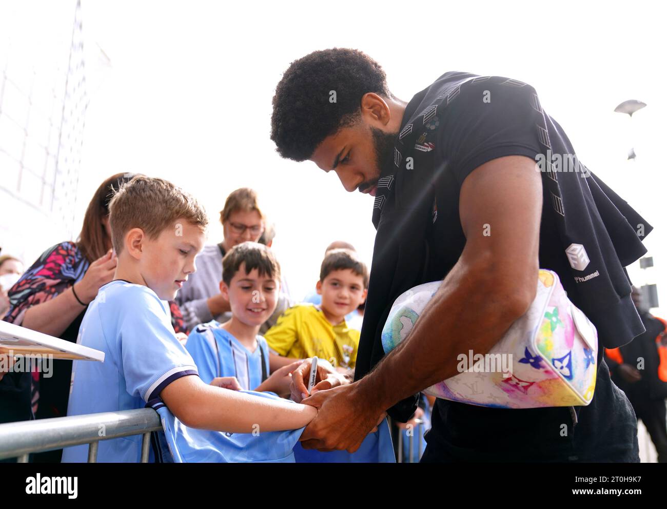 Coventry City's Ellis Simms signs a shirt for a fan ahead of the Sky Bet Championship match at the Coventry Building Society Arena, Coventry. Picture date: Saturday October 7, 2023. Stock Photo