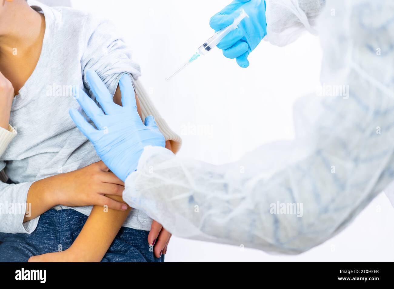 Child with his mother before the vaccine injection. Vaccination of children. Immunization in the coronavirus pandemic, covid-19 Stock Photo