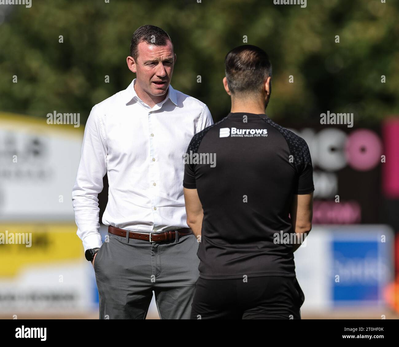 Neill Collins Head coach of Barnsley speaks to Martin Devaney first team coach of Barnsley  during the Sky Bet League 1 match Exeter City vs Barnsley at St James' Park, Exeter, United Kingdom, 7th October 2023  (Photo by Mark Cosgrove/News Images) Stock Photo
