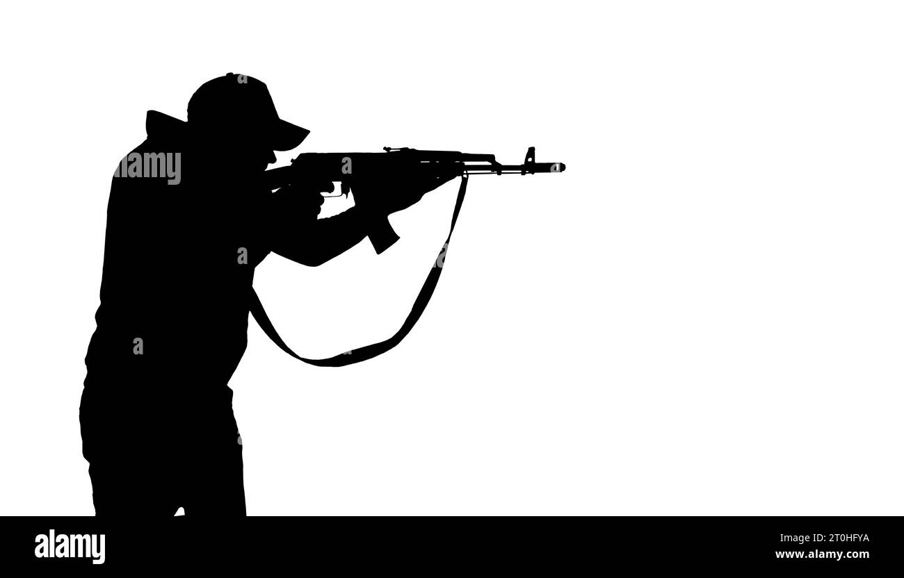militiaman with a machine gun, silhouette Stock Photo