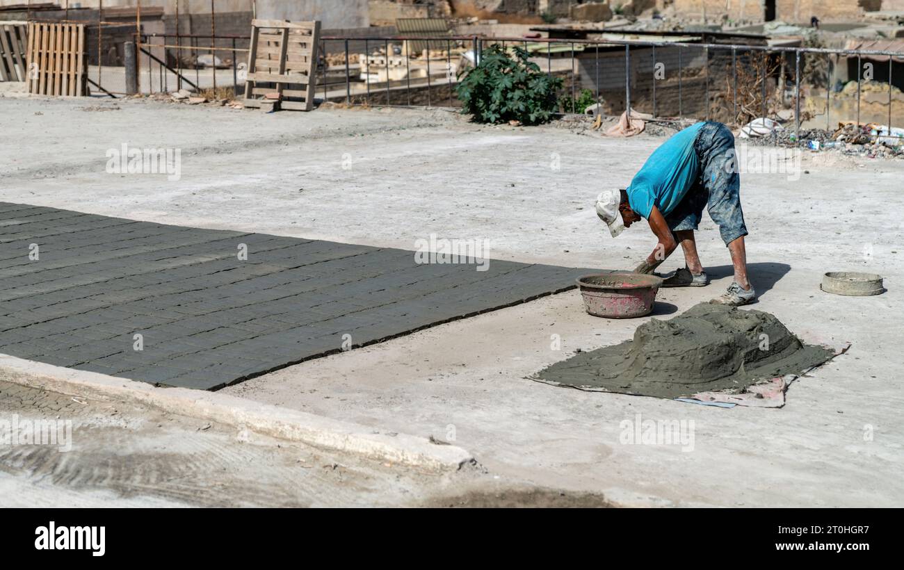 Fes, Morocco 10 September 2022 Moroccan craftsman making tiles with