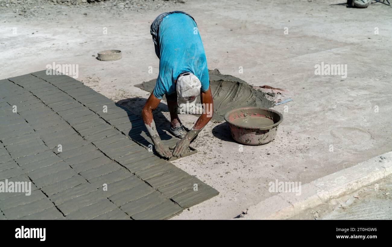 Fes, Morocco 10 September 2022 Moroccan craftsman making tiles with