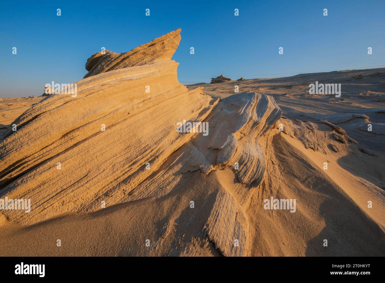 Desert eroded rock pattern with clear sky during the hot sun. Desert ...