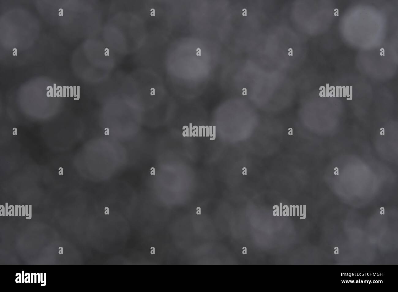 Abstract dark gray background with bokeh Stock Photo