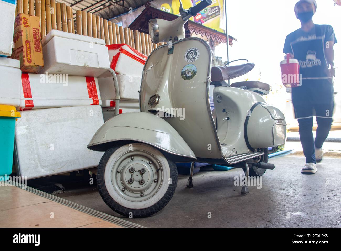 NAN, THAILAND, MAY 19 2023, A Vespa motorcycle is parked in front of the restaurant Stock Photo