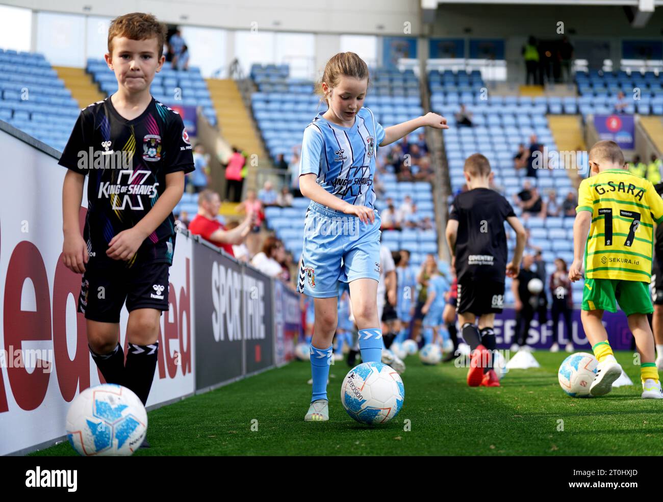 Coventry City match day mascots warm up on the pitch ahead of the Sky Bet Championship match at the Coventry Building Society Arena, Coventry. Picture date: Saturday October 7, 2023. Stock Photo