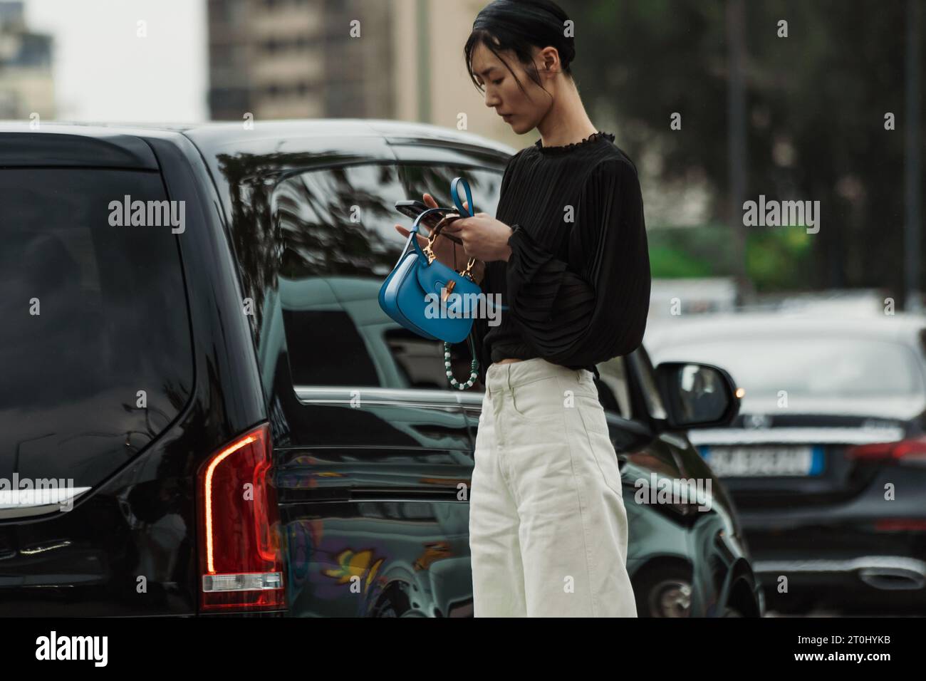 A model  seen outside PRADA show during Milan Fashion Week Womenswear Spring/Summer 2024. Stock Photo