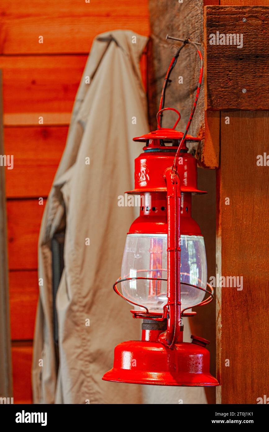 Red oil lamp hanging on a wall Stock Photo