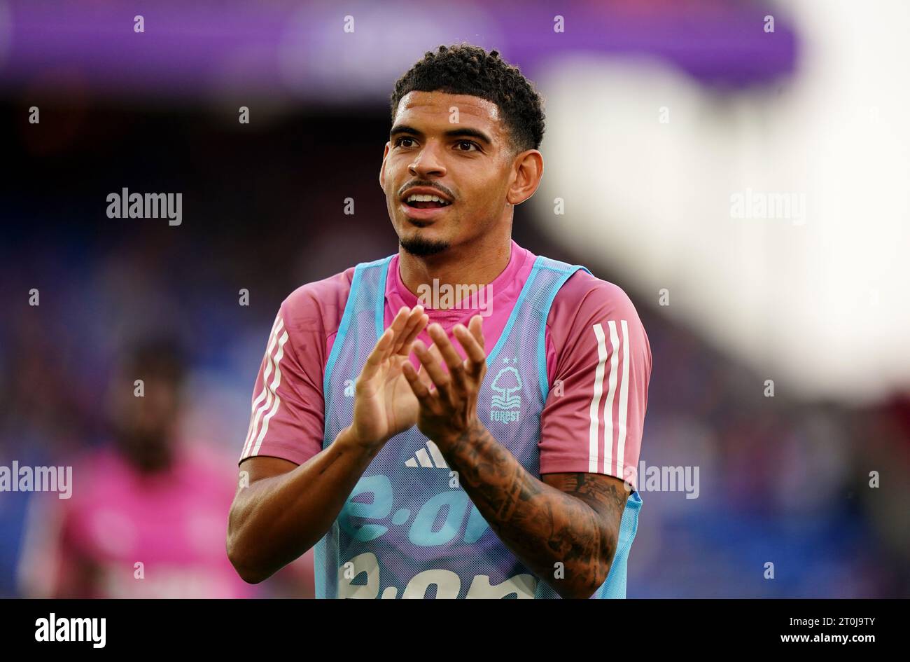 Nottingham Forest's GibbsWhite applauds the away fan during the