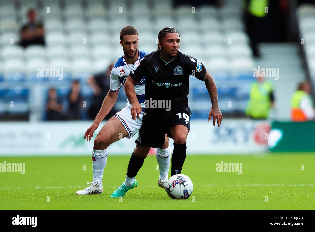 Blackburn Rovers' Tyrhys Dolan feels pressure from Queens Park Rangers' Ziyad Larkeche during
