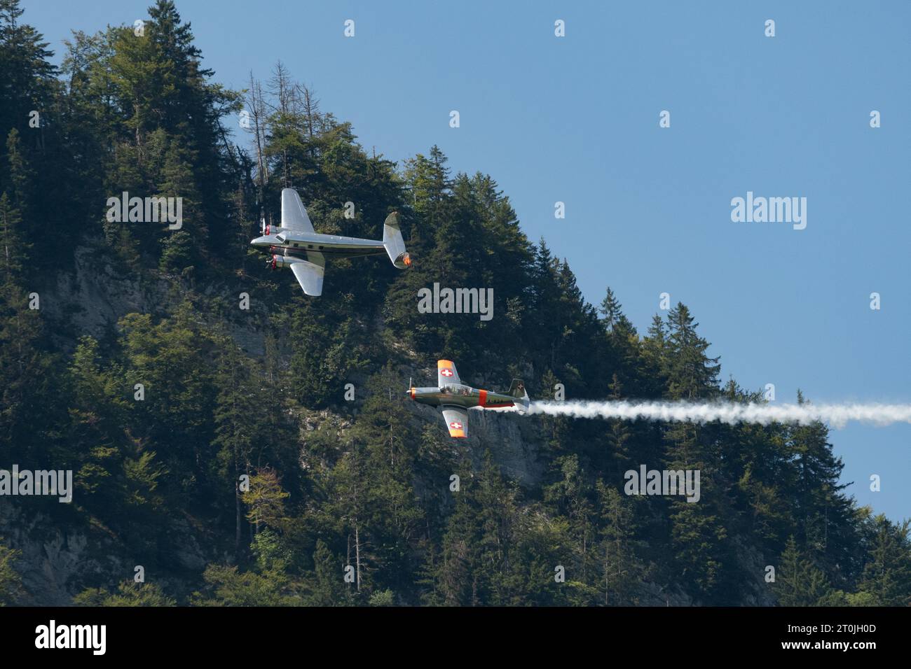 Mollis, Switzerland, August 18, 2023 Lockheed Model 12 Electra Junior and a Pilatus P-3-05 aircraft in formation flight during an air show Stock Photo
