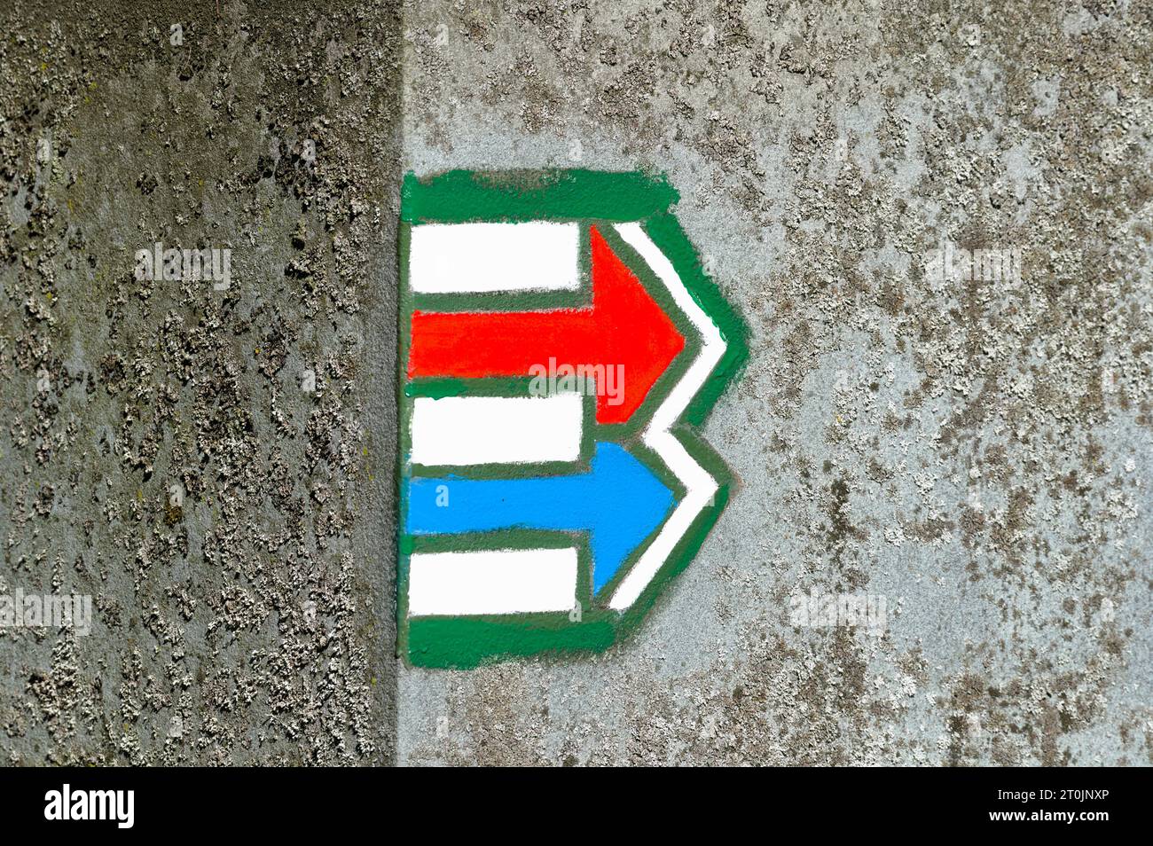 Tourist signs marks used in Czech republic. Red and blue arrows. Green and yellow marks are used for navigation on trails too. Direction concept. Stock Photo