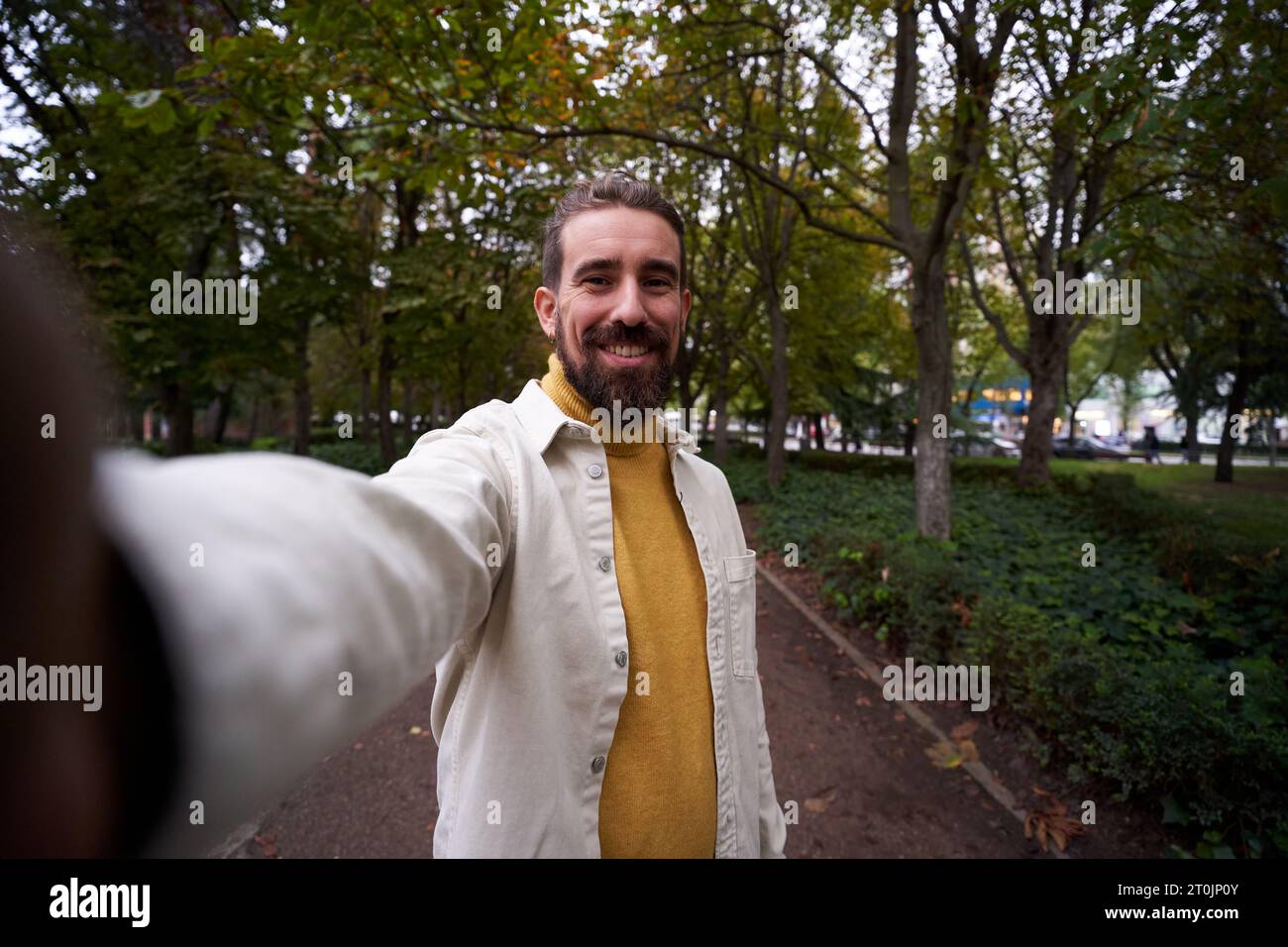 Cheerful handsome man taking hi-res stock photography and images - Alamy